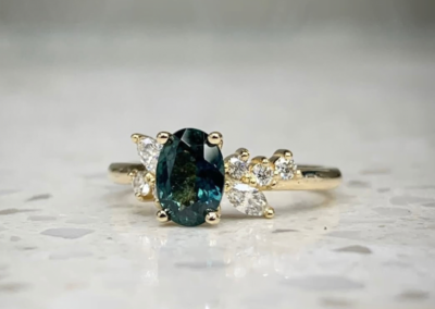 Luxury custom white gold teal sapphire ring with diamond halo, Leduc, AB