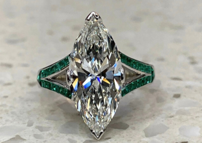 Luxury yellow gold marquise diamond ring with emerald baguette side stones, Leduc
